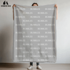 custom dog blanket that is personalized with bubble name in plush and sherpa fabric on light grey background