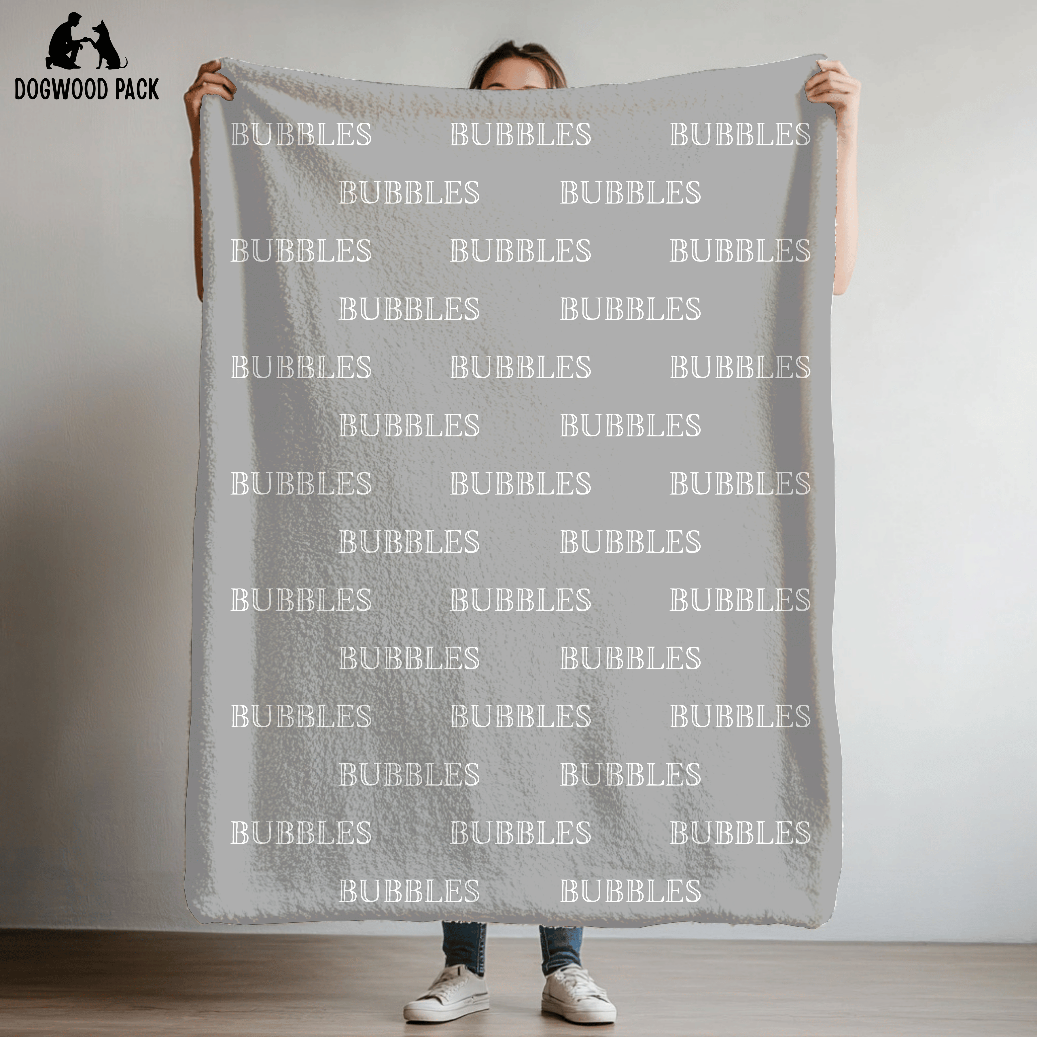 custom dog blanket that is personalized with bubble name in plush and sherpa fabric on light grey background