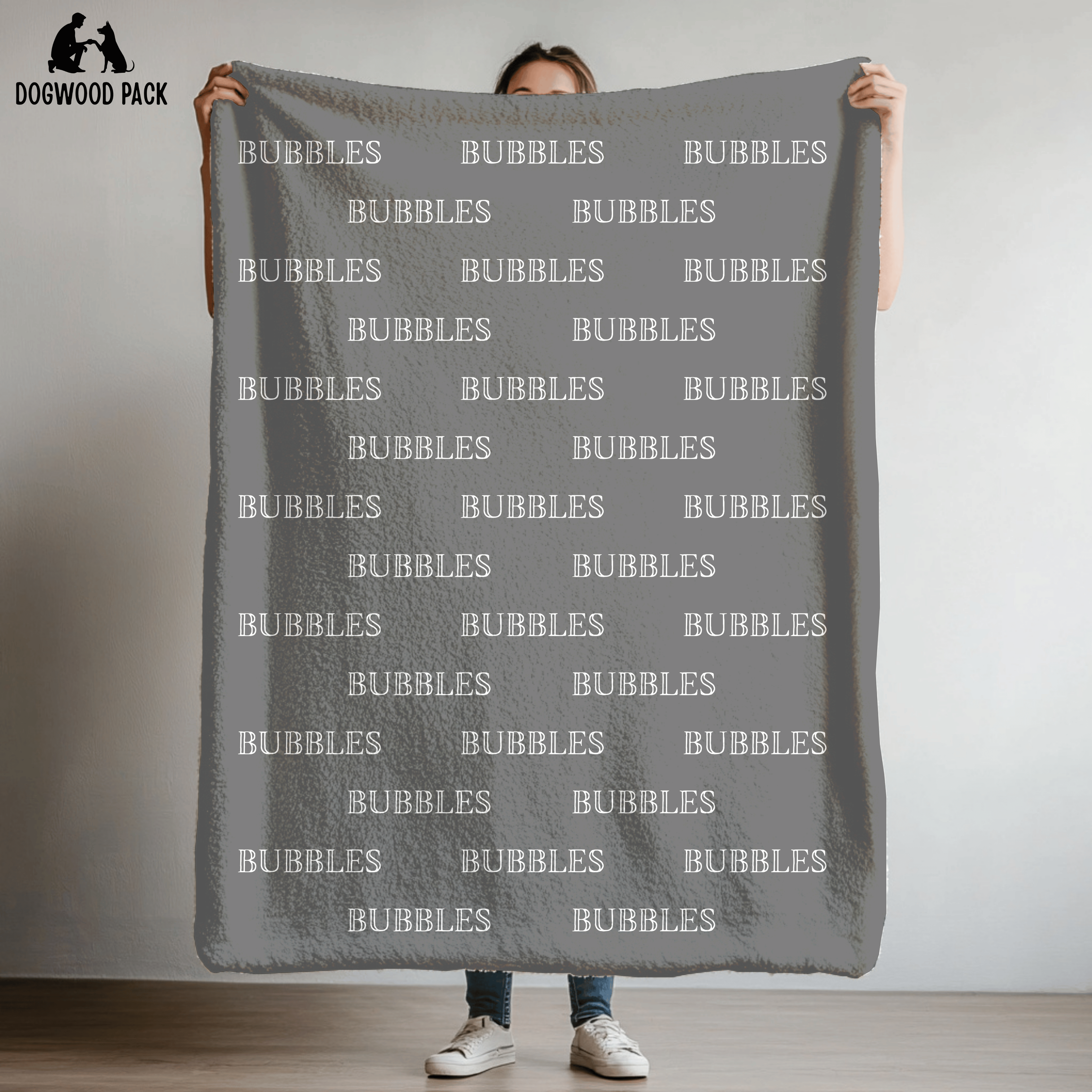 custom dog blanket that is personalized with bubble name in plush and sherpa fabric on grey background