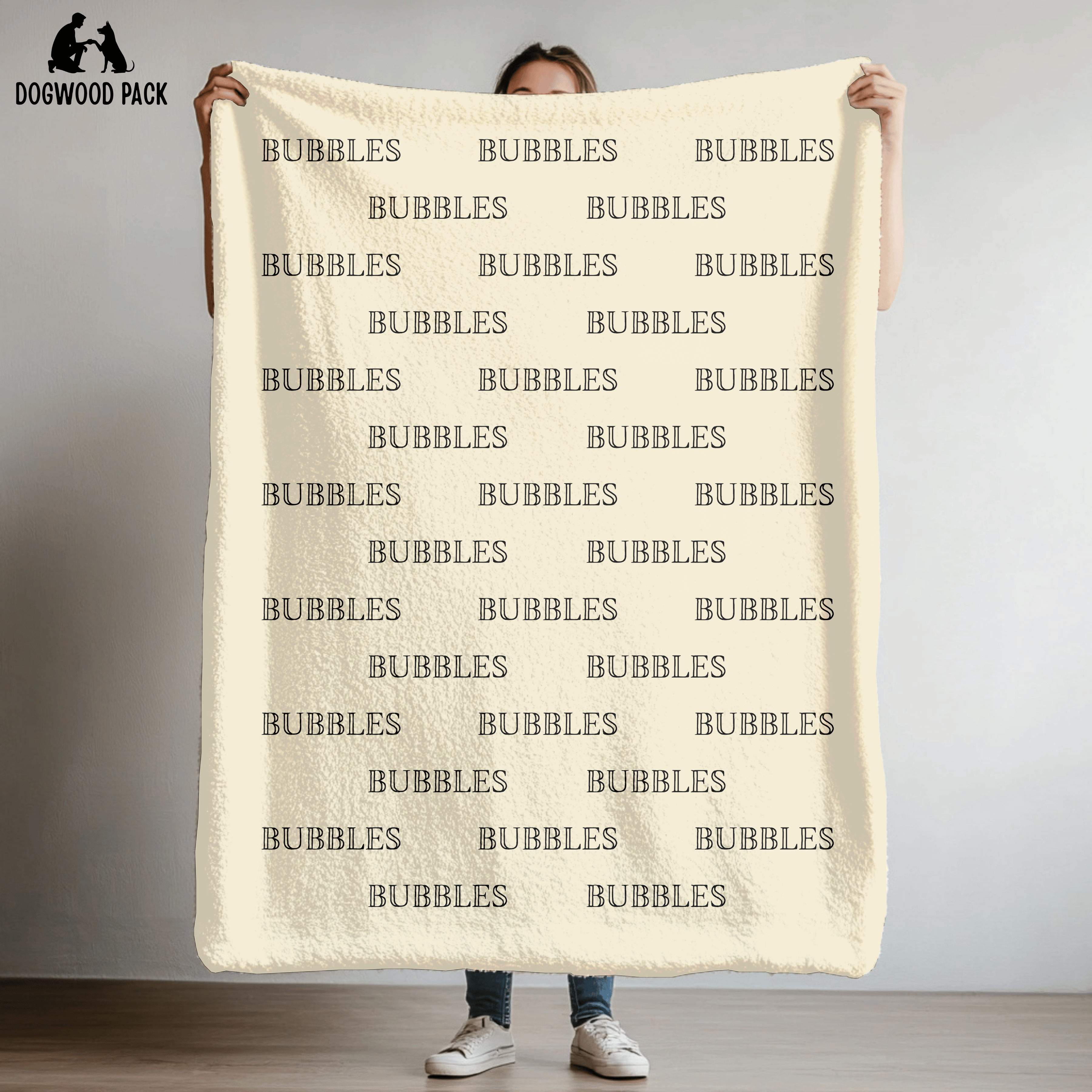 custom dog blanket that is personalized with bubble name in plush and sherpa fabric on beige background