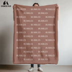custom dog blanket that is personalized with bubble name in plush and sherpa fabric on red background