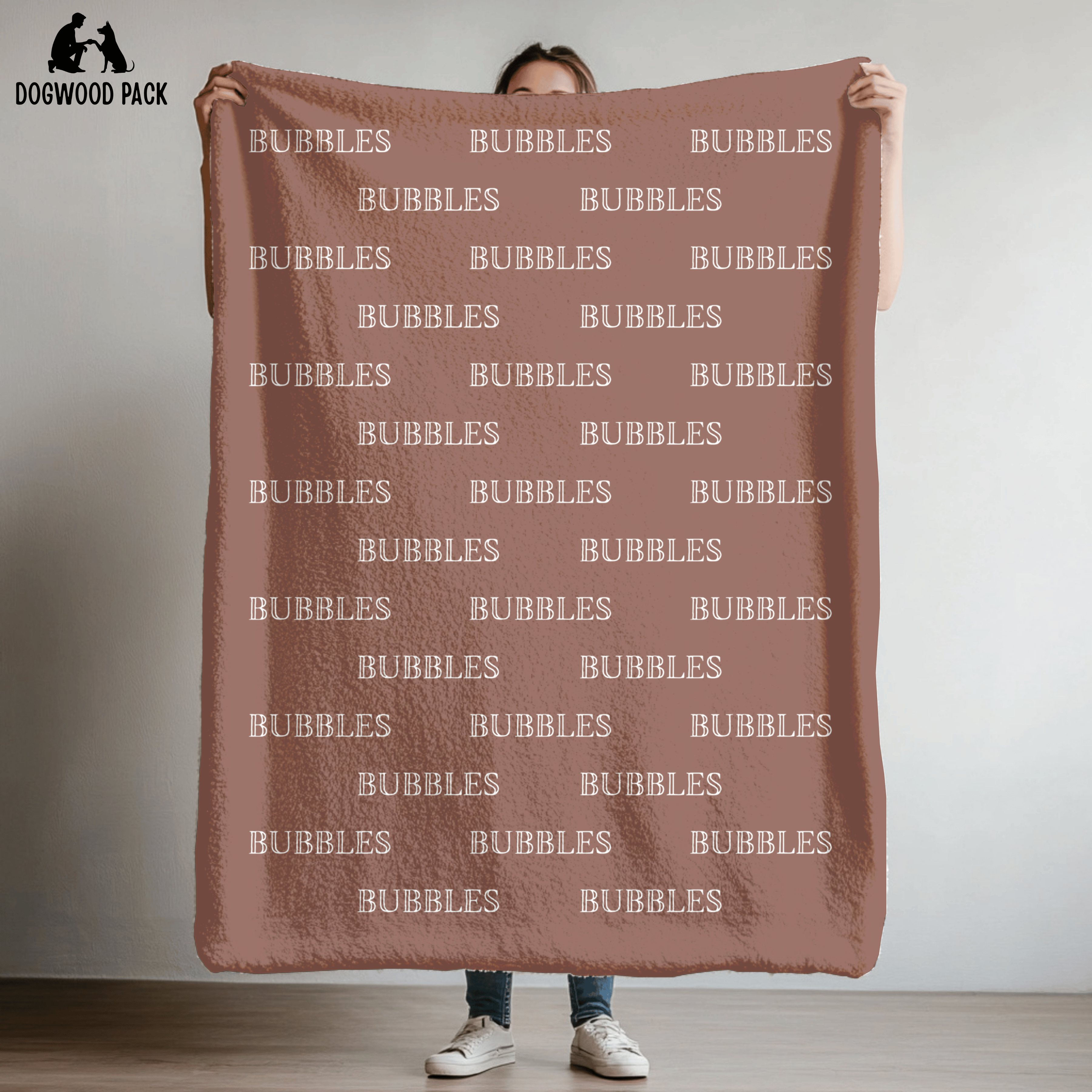 custom dog blanket that is personalized with bubble name in plush and sherpa fabric on red background