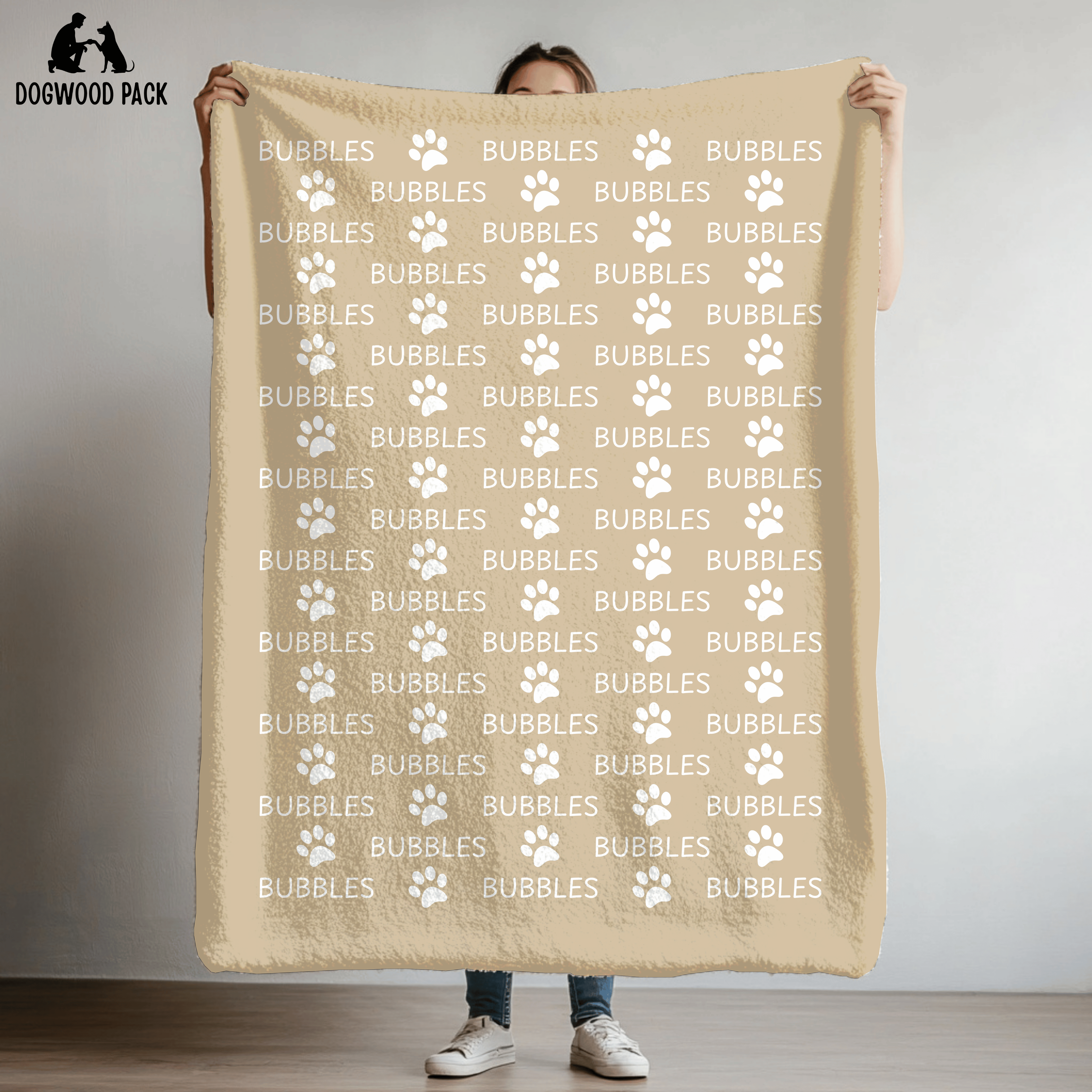 custom dog blanket that is personalized with name and paw print design in plush and sherpa fabric on tan background