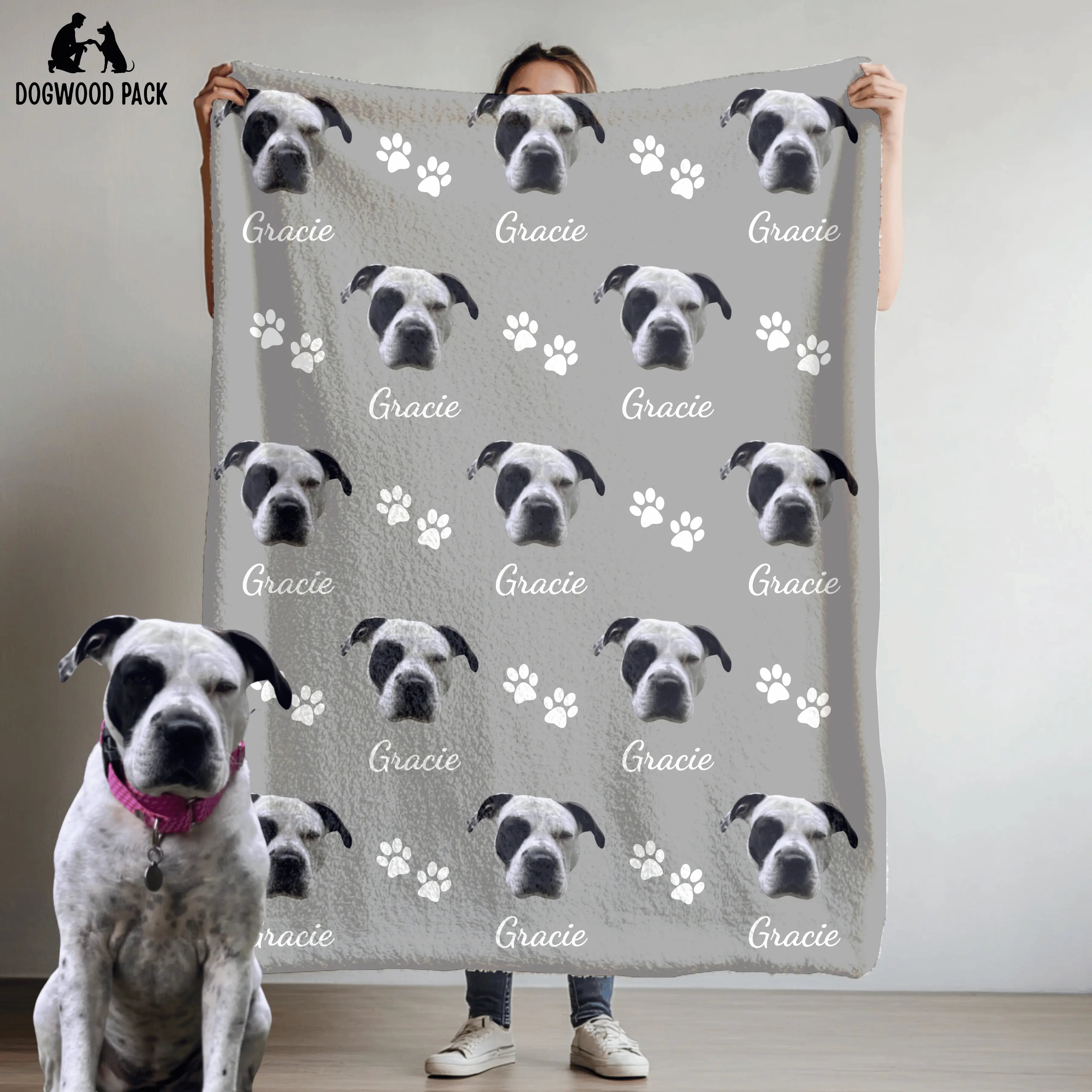 custom dog blanket with face and name with a paw-print design on a light grey background
