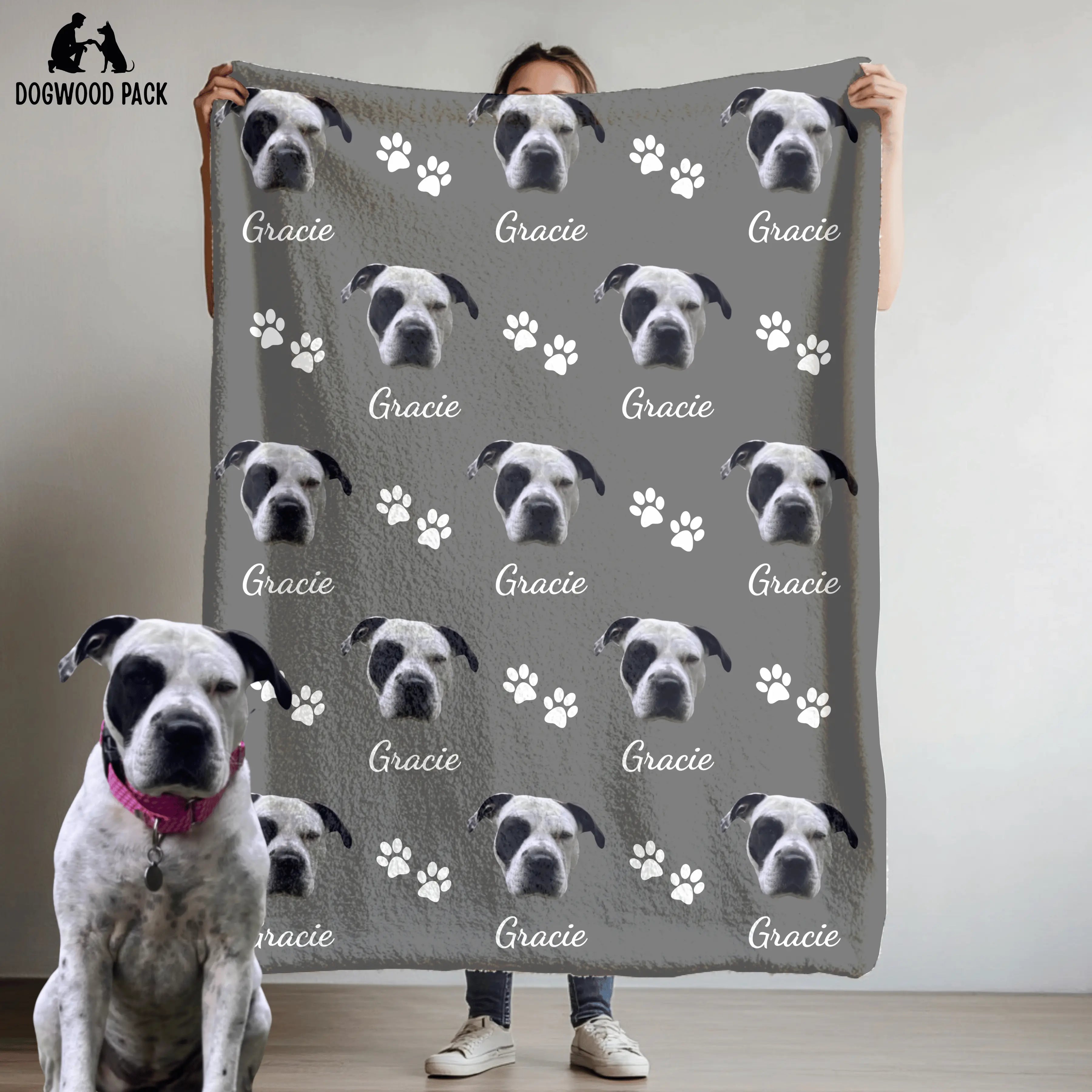 custom dog blanket with face and name with a paw-print design on a grey background