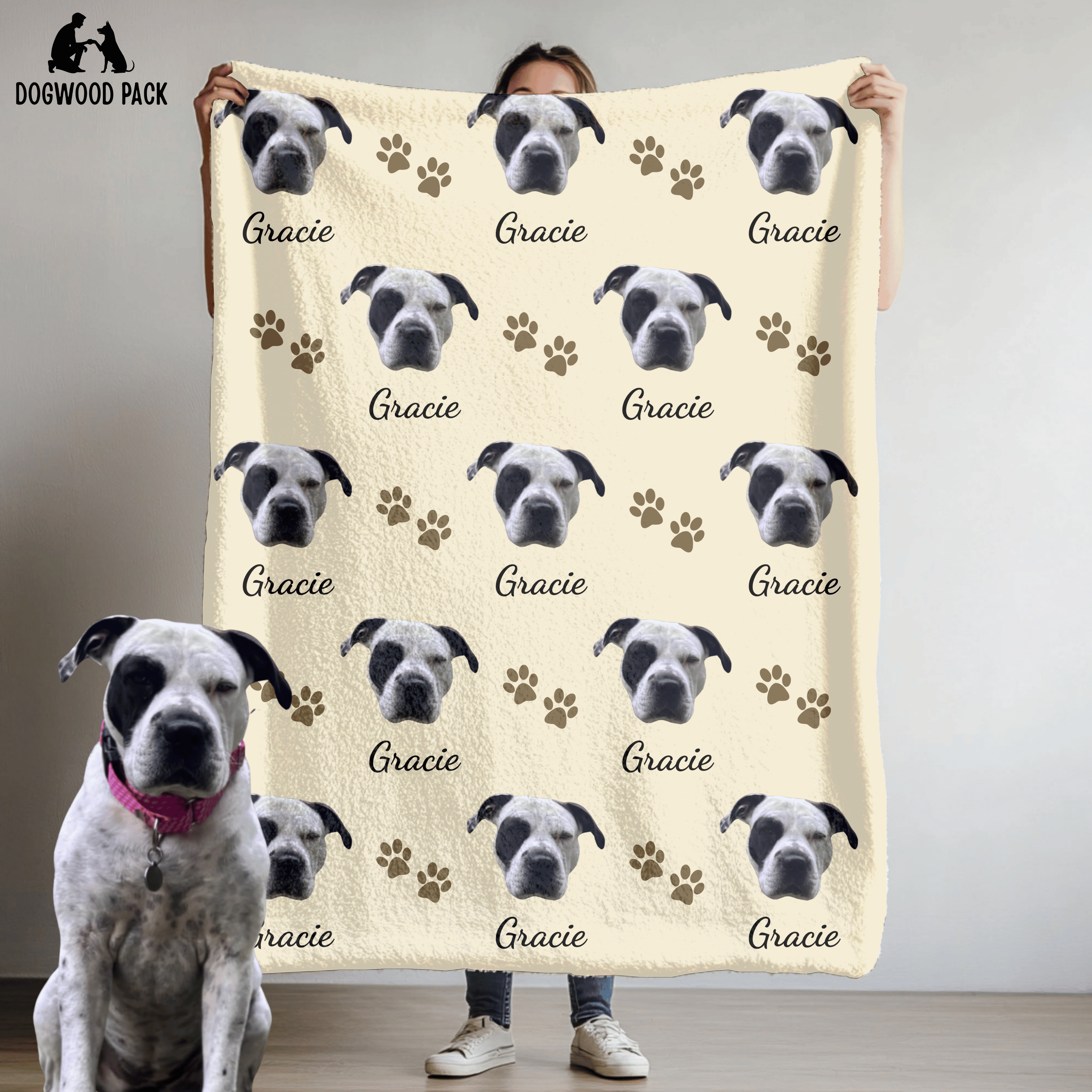 custom dog blanket with face and name with a paw-print design on a beige background