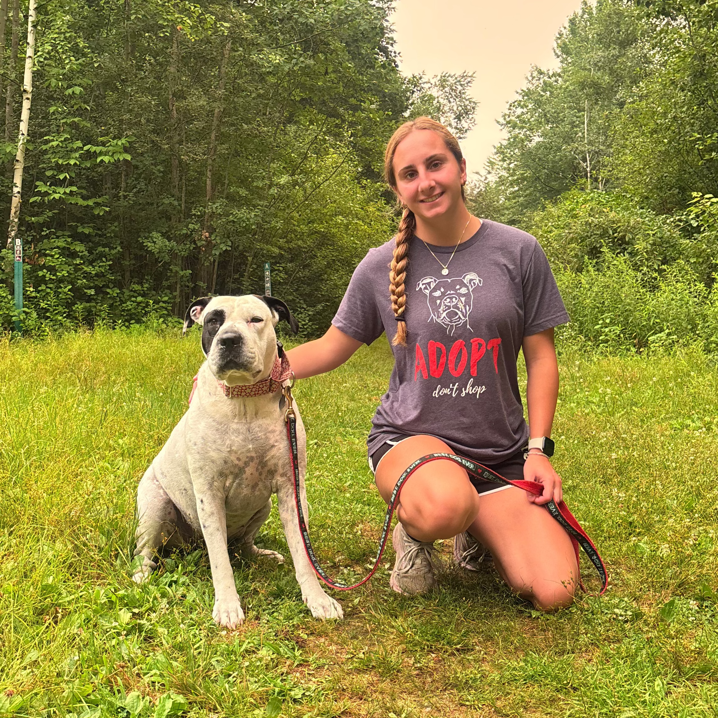 Girl with a rescue pitbull wearing Adopt Don't Shop Shirt – Adoption Awareness Tee