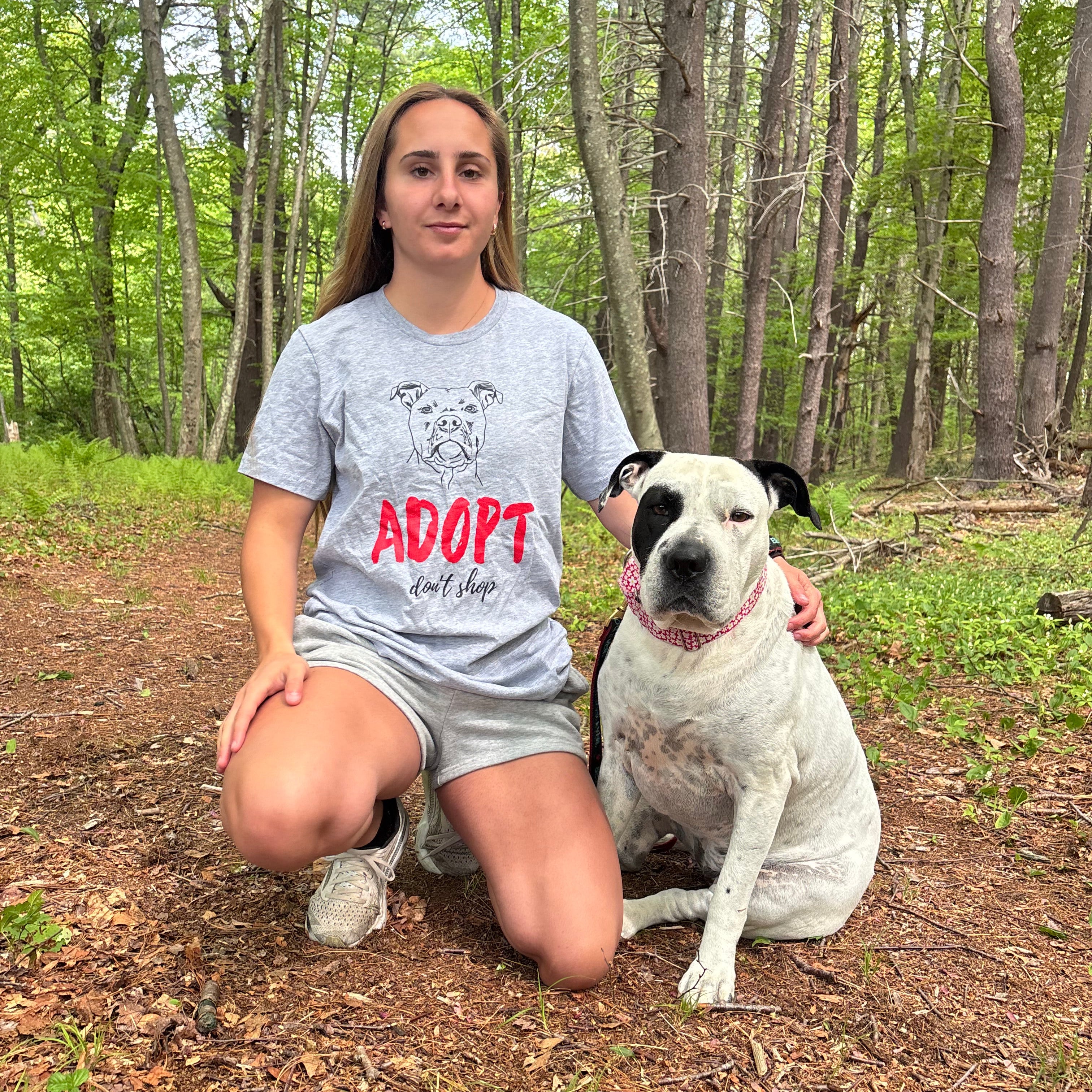Girl with a rescue pitbull wearing Adopt Don't Shop Shirt – Adoption Awareness Tee