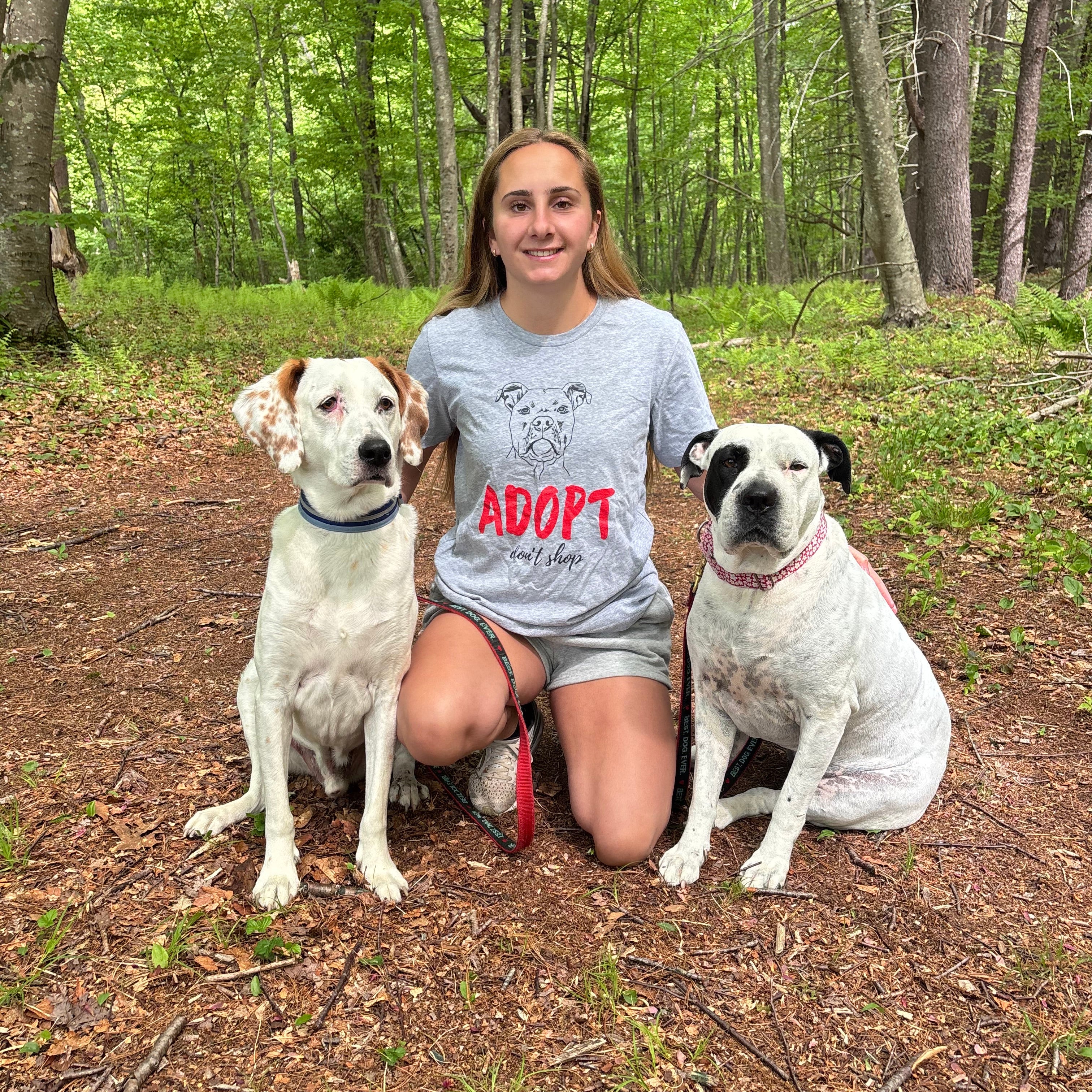 Girl with two rescue dogs wearing Adopt Don't Shop Shirt – Adoption Awareness Tee